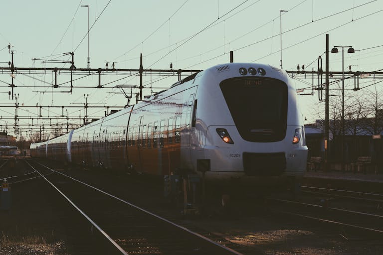 A sleek modern train at Norrköping railway station in Sweden, capturing transportation efficiency.